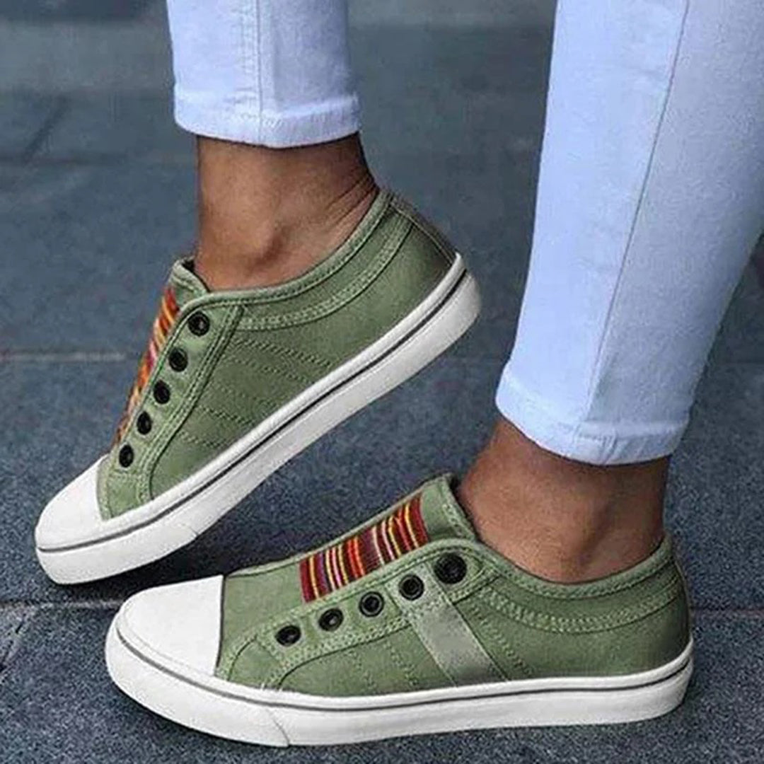 Red women's fashion sneakers, low-top design for a casual yet chic look, ideal for street style