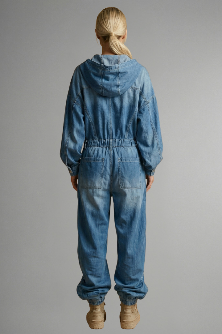 Relaxed fit blue hooded women's jumpsuit, long sleeve, comfortable one-piece with pockets for everyday lounge.