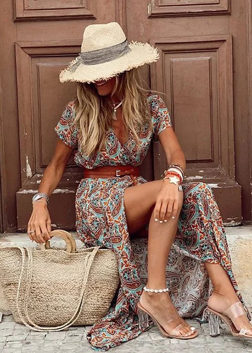 Elegant women's bohemian floral maxi dress with short sleeves, V-neck, and a stylish side split, perfect for vacation.