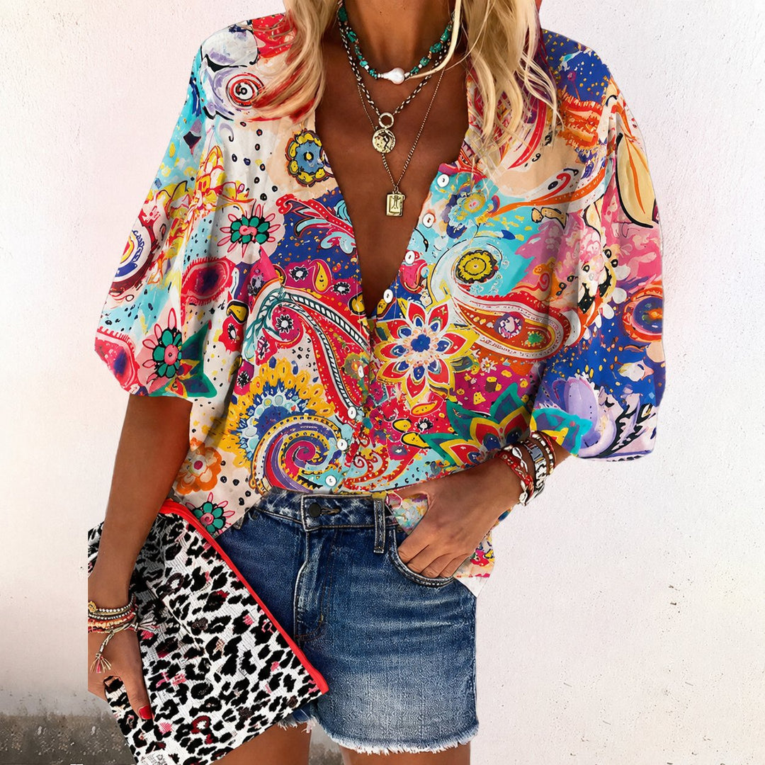 Relaxed fit women's floral print V-neck shirt, short sleeve & button-front, ideal for everyday bohemian style.