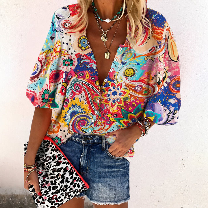 Relaxed fit women's floral print V-neck shirt, short sleeve & button-front, ideal for everyday bohemian style.