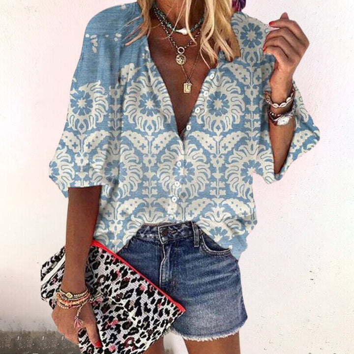 Ladies' short sleeve floral V-neck blouse with button front, a chic and relaxed bohemian top for everyday wear.