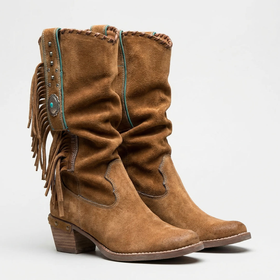 Mid-calf women's Western boots with dramatic fringe, a sleek pointed toe, and stable block heel.