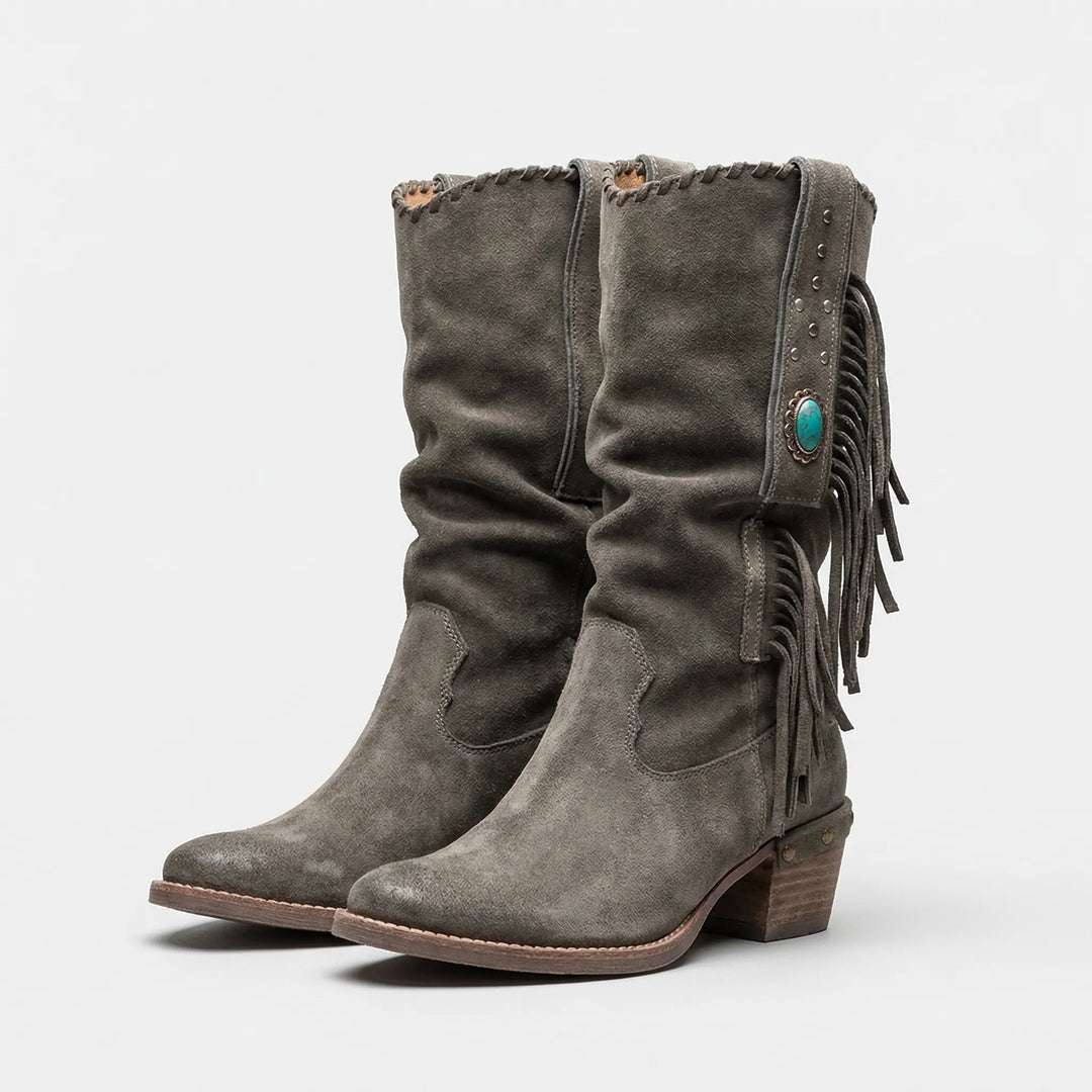 Women's bohemian fringe mid-calf Western boots with a pointed toe and block heel, ideal for fashion.