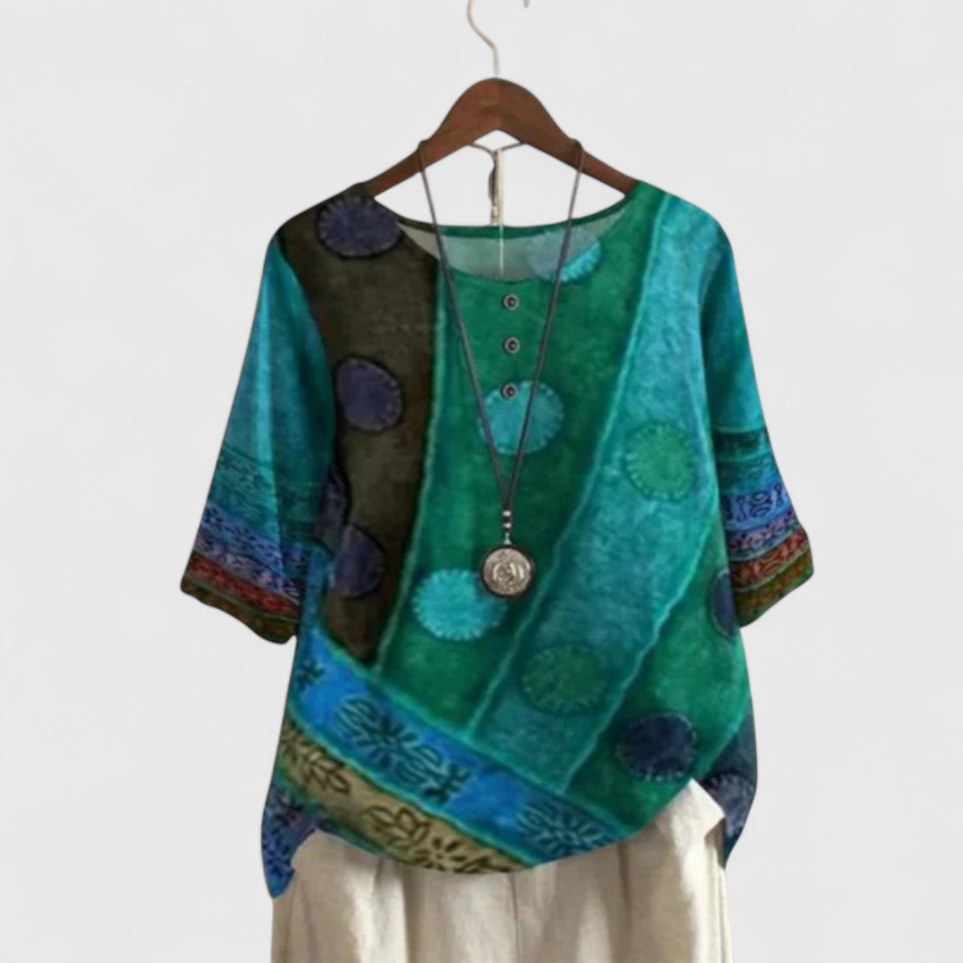 Stylish women's bohemian patchwork top with flowy short sleeves, perfect for casual outings & travel.