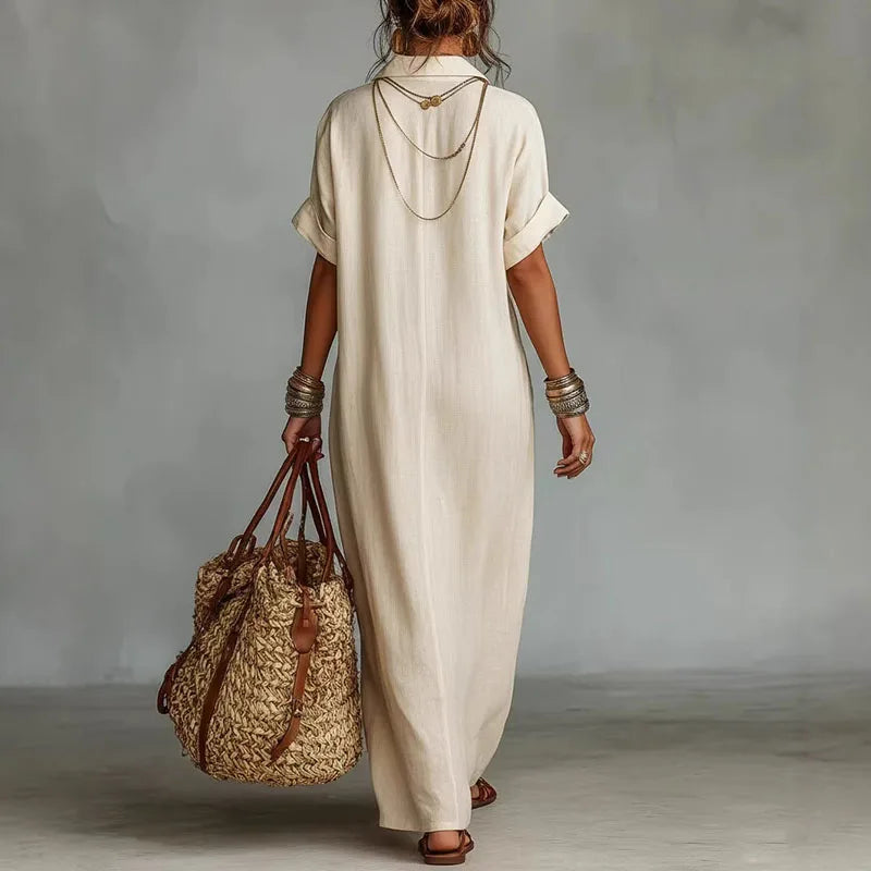 Flowing women's bohemian maxi dress, vibrant print & deep V-neck. Ideal comfortable casual elegant summer wear.