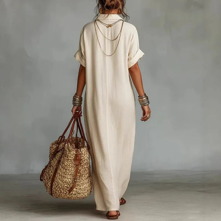 Flowing women's bohemian maxi dress, vibrant print & deep V-neck. Ideal comfortable casual elegant summer wear.
