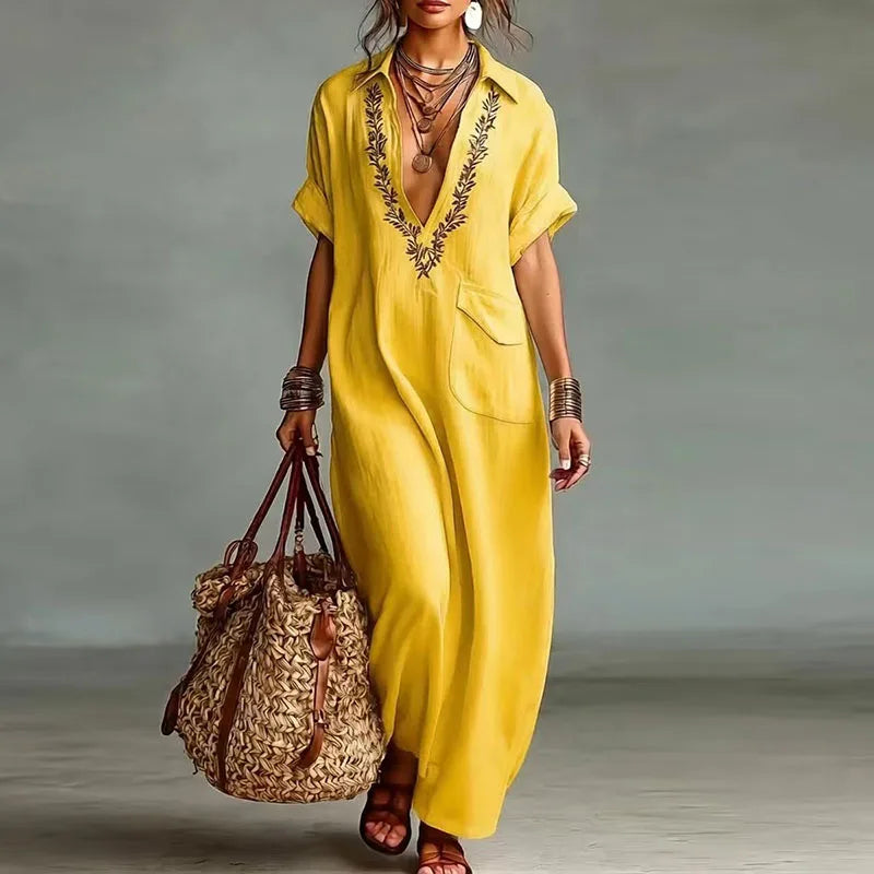 Elegant short-sleeve women's maxi dress. Bohemian print, deep V-neck, comfortable for beach or vacation.
