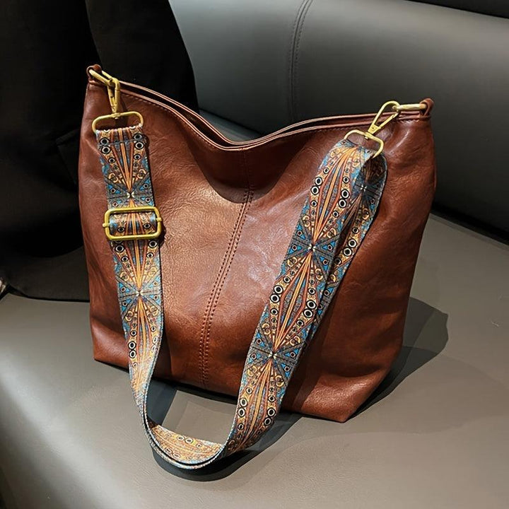 Comfortable women's bohemian shoulder bag, a slouchy design with a decorative patterned strap.