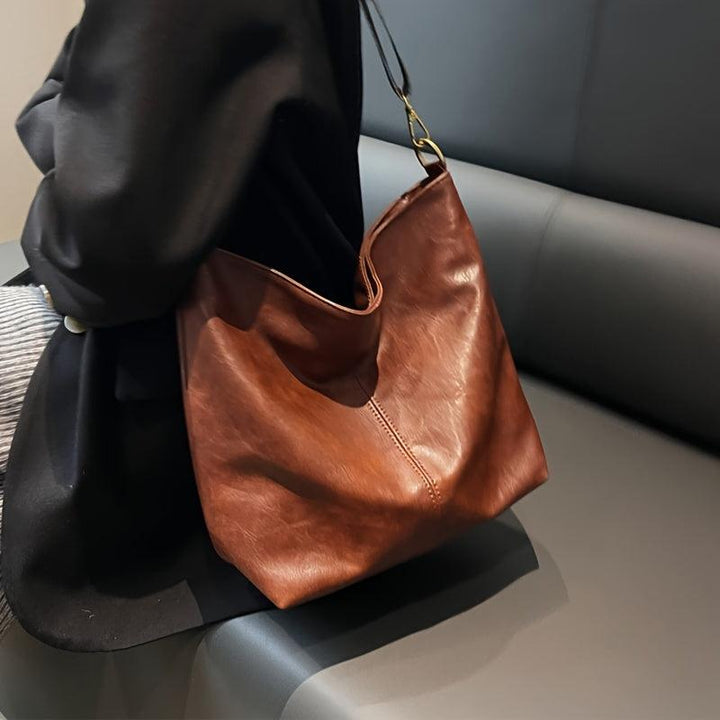 Versatile women's bohemian shoulder bag, a stylish accessory with a vibrant patterned strap, great gift.