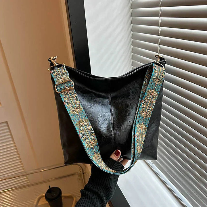 Fashionable women's bohemian handbag, an essential accessory featuring a unique patterned strap.