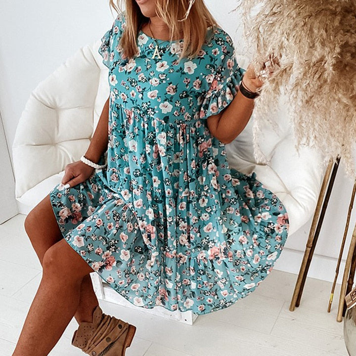 Fitted waist boho floral midi dress for women. Ruffled details add a romantic touch to this versatile summer dress.