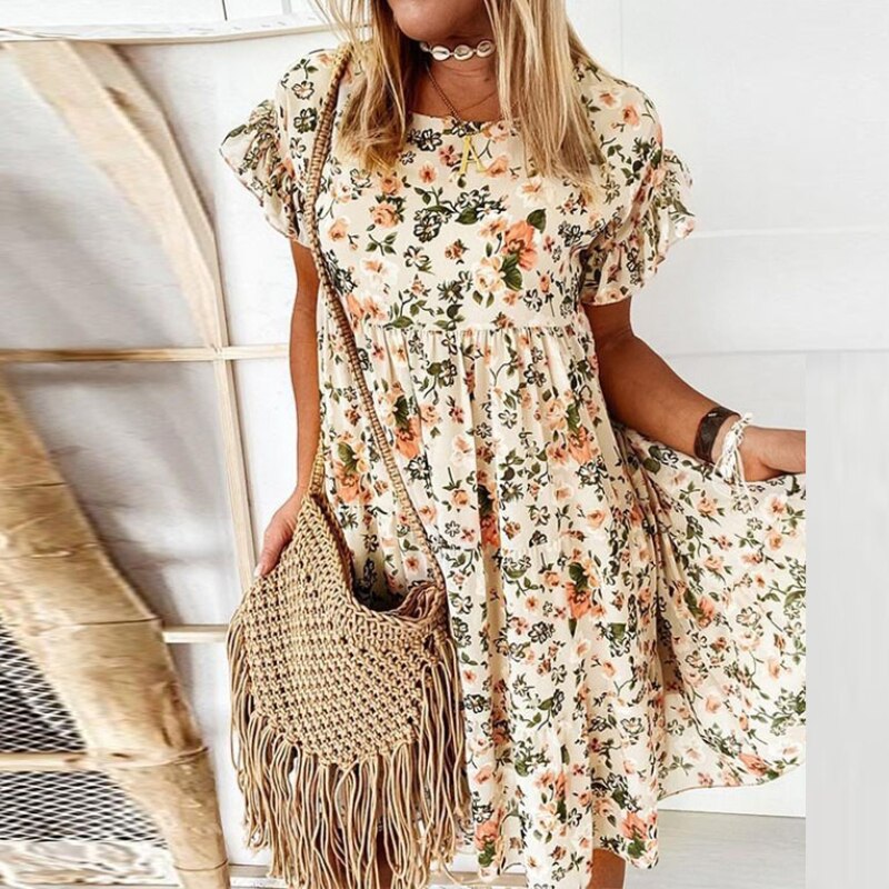 Casual yet elegant women's floral midi dress. Boho style with ruffles & a flattering fitted waist for summer events.