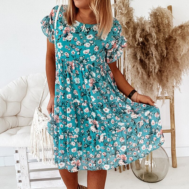 Women's summer boho floral midi dress, a ruffled design with a fitted waist. Ideal for casual, romantic outings.
