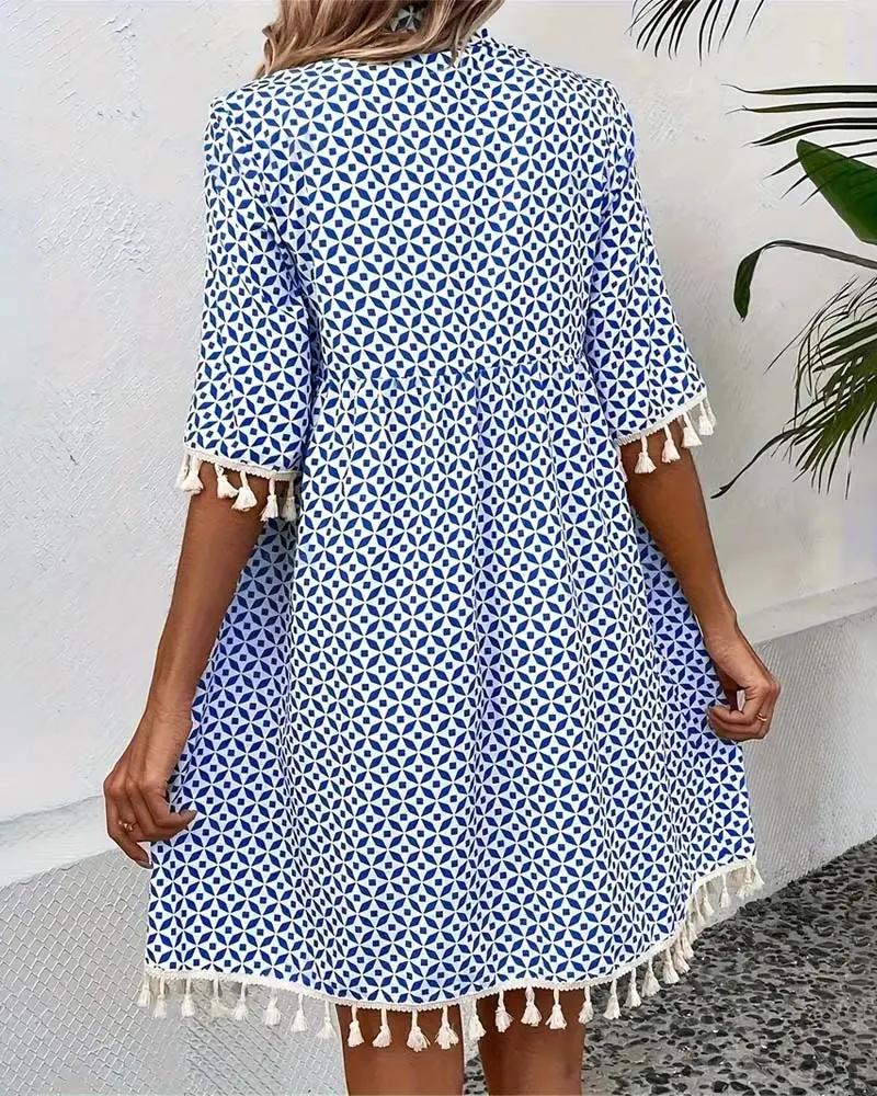 Boho mini tunic dress for women, vibrant geometric print, short sleeves & tassel hem. Great summer beach wear.