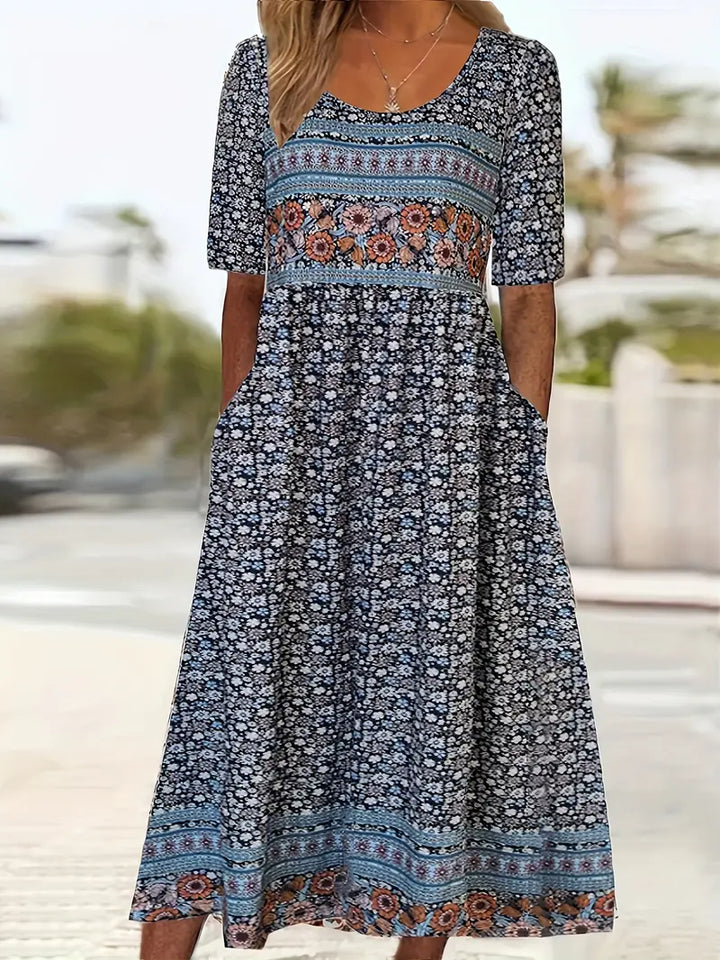 Casual women's floral print boho midi dress. Features a round neck, short sleeves, and gathered waist. Perfect for summer.