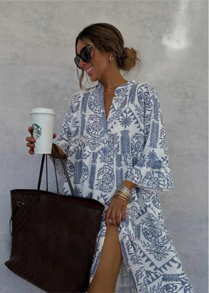Flowy boho midi dress for women, featuring a unique print, long sleeves, and elegant mandarin collar.