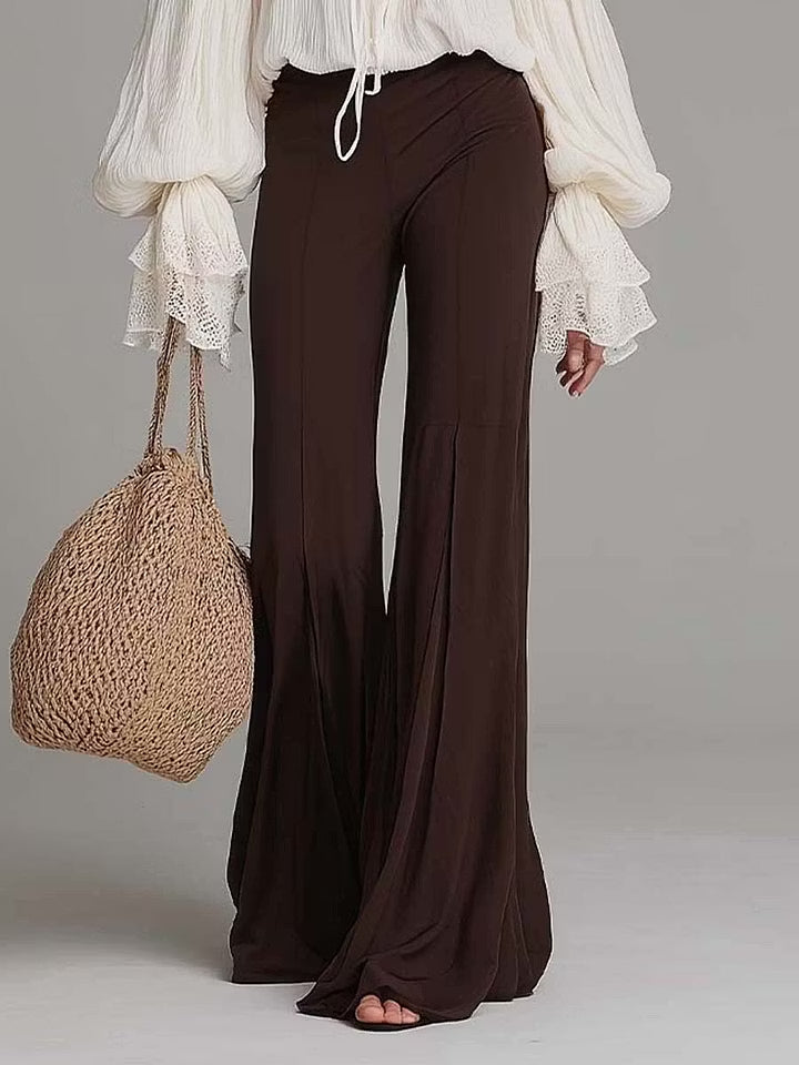 Trendy women's boho two-piece outfit with a flattering lace-up crop top & comfortable wide-leg pants. Festival ready!