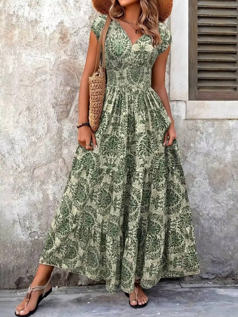 Chic women's V-neck midi dress in a flowing boho design. Perfect for versatile summer style.