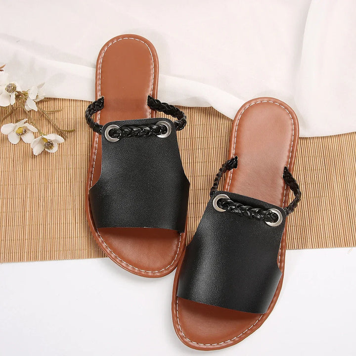 Summer-ready women's slip-on sandals, featuring a chic braided thong design