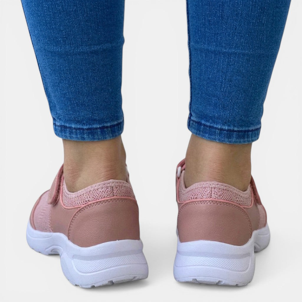 Light pink women's breathable orthopedic slip-on sneakers, offering ultimate foot support for casual wear.