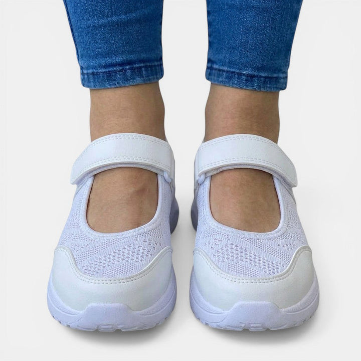 Stylish blue women's comfort shoes, slip-on sneakers with breathable mesh & ergonomic foot support.