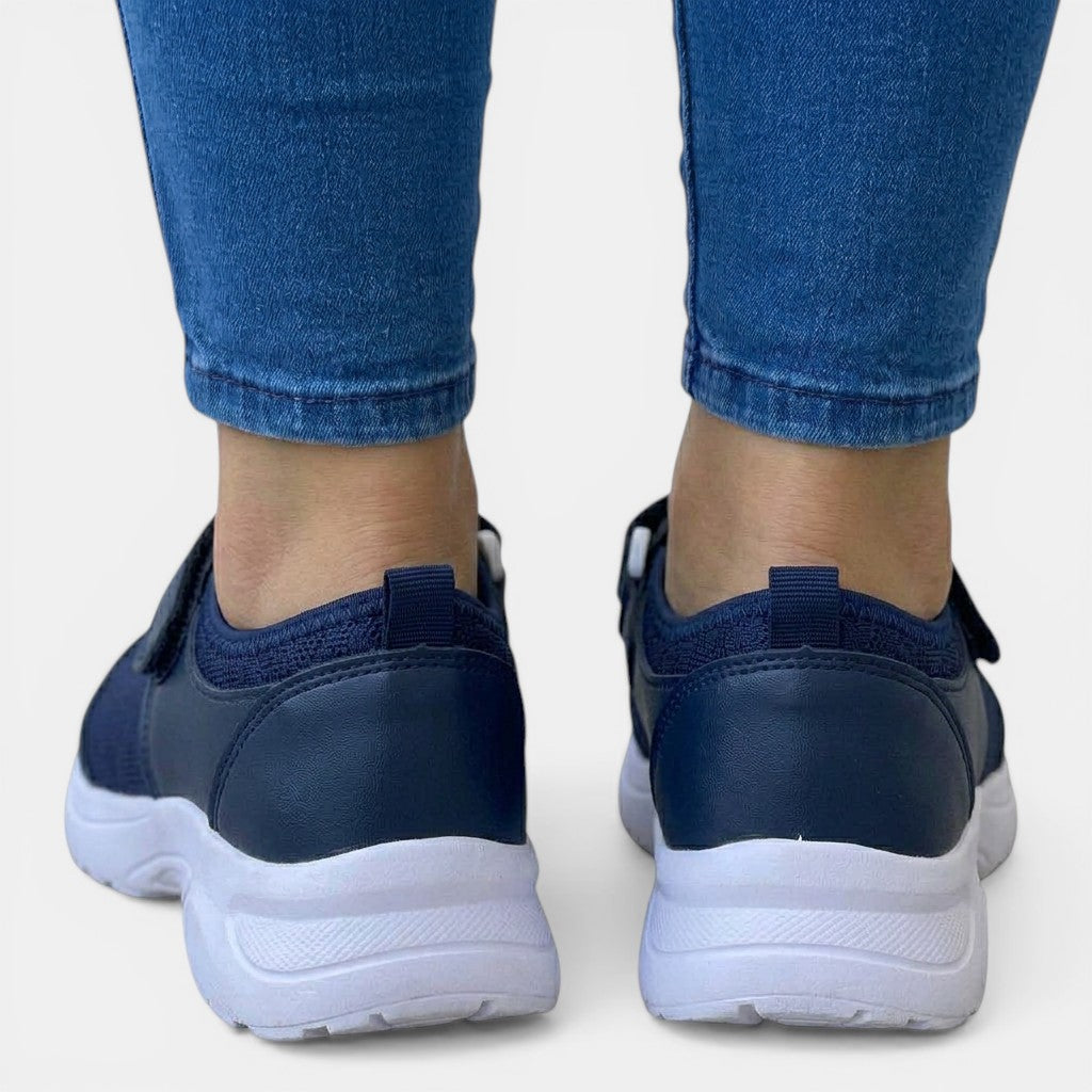 Women's orthopedic walking sneakers, slip-on design with breathable fabric & supportive footbed.