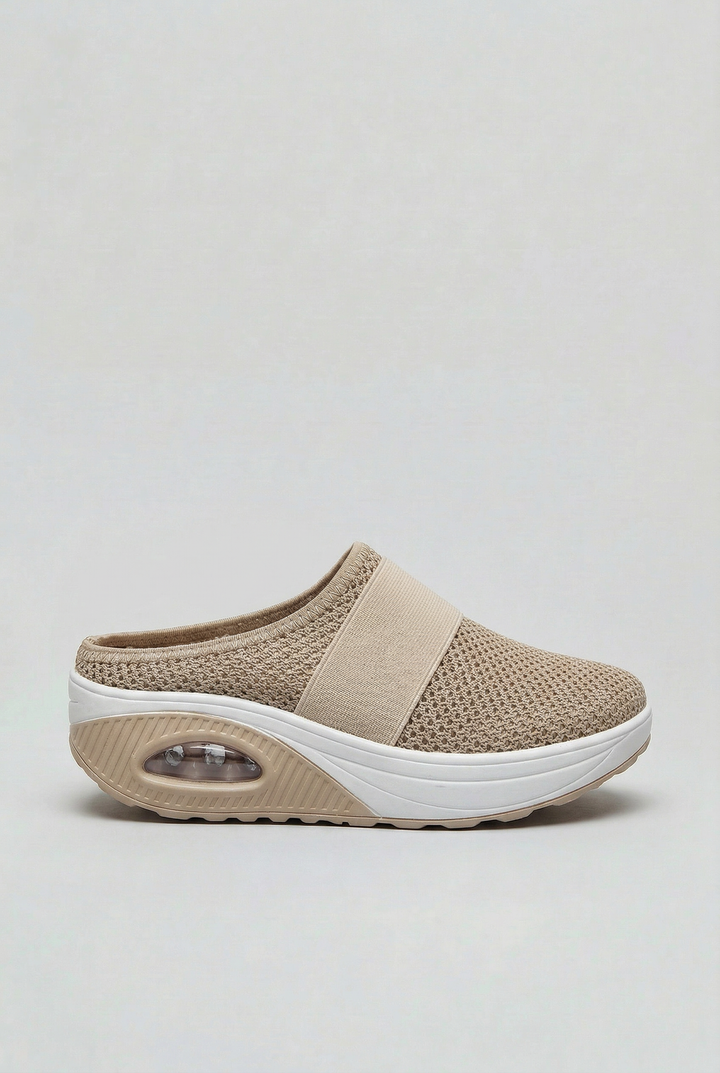 Women's breathable slip-on mules with air cushion sole for ultimate comfort.