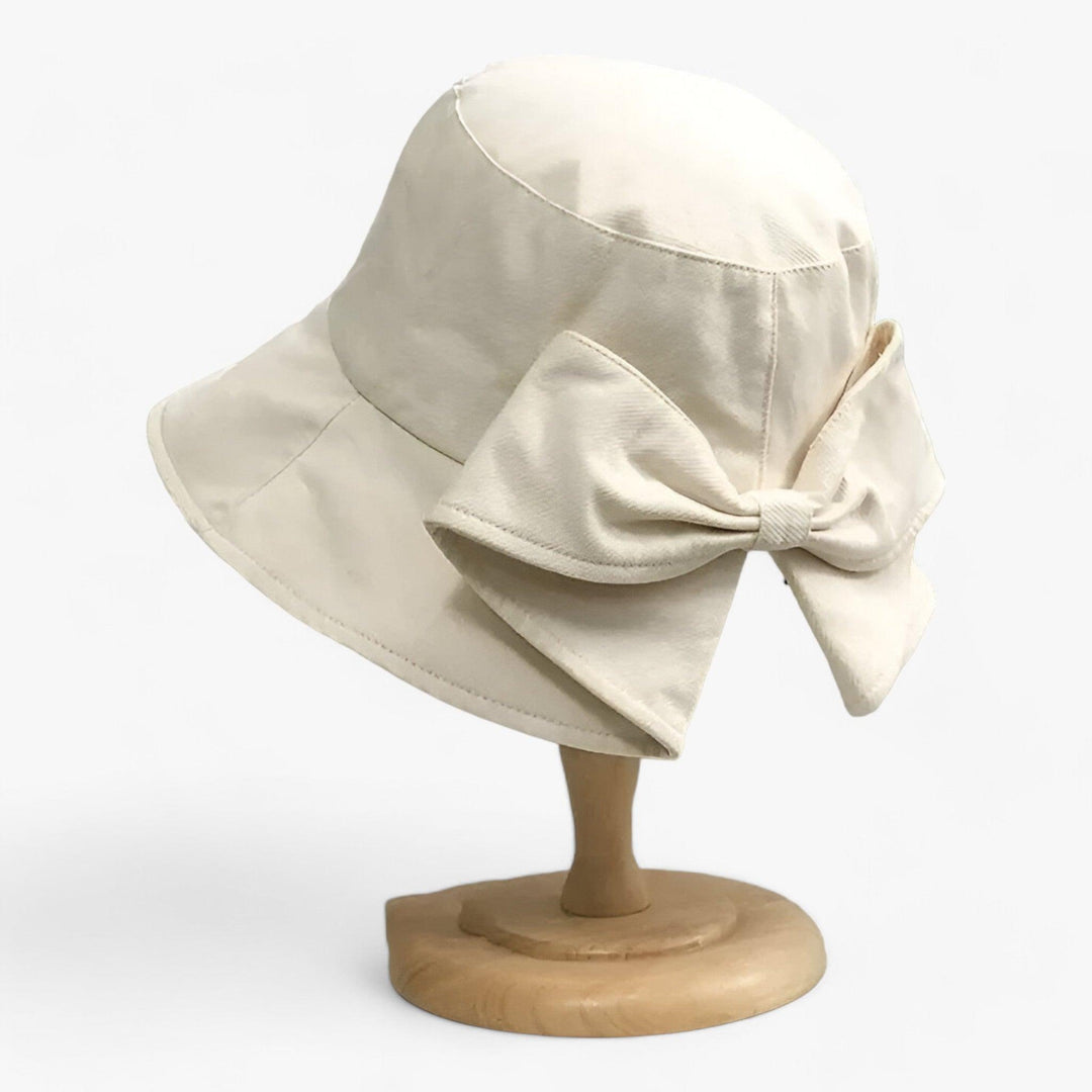 Lightweight, breathable white cotton sun hat for women. Stylish outdoor bucket hat, great for summer, beach, and travel.