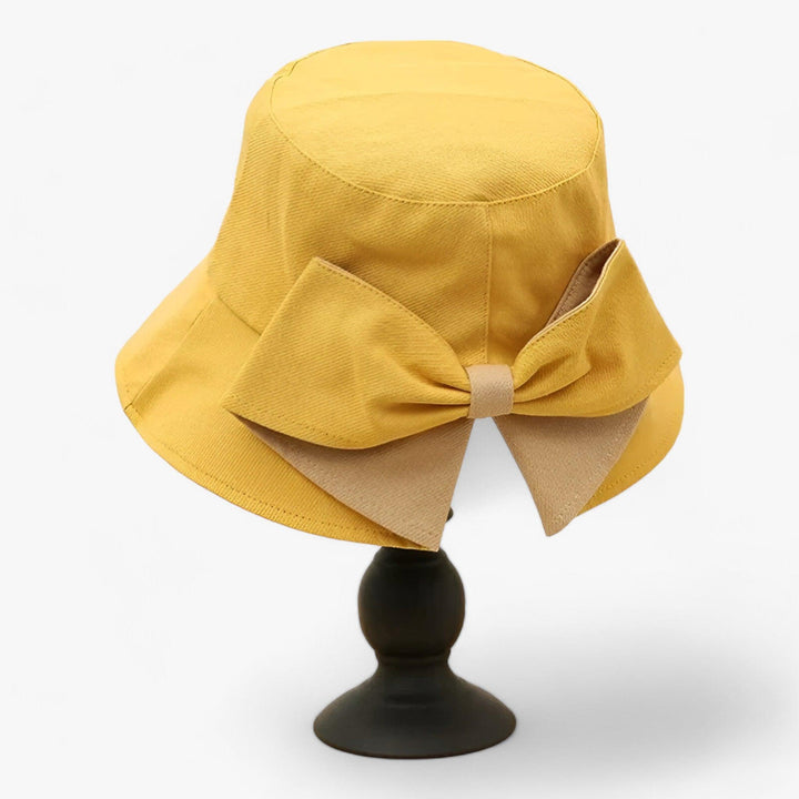 White cotton sun hat for women, breathable and stylish. Ideal for summer, beach, travel, and outdoor casual wear.