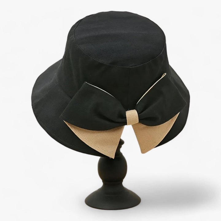 Breathable white cotton sun hat for women. Essential outdoor accessory providing sun protection for beach, travel, summer.