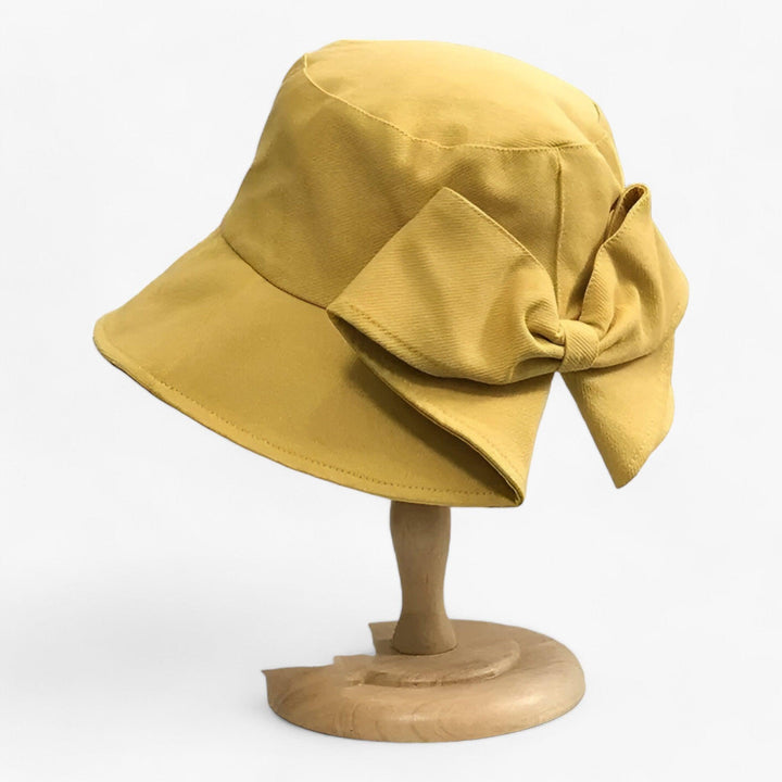 White breathable cotton sun hat for women. Essential summer outdoor hat, perfect for beach days & travel adventures.
