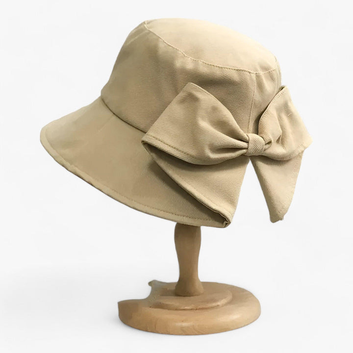 Women's white cotton sun hat, breathable bucket style. Ideal for outdoor adventures, summer, beach, travel & casual wear.