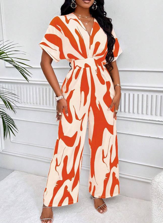 Elegant women's V-neck print jumpsuit. Stylish short sleeve, loose fit for sophisticated summer fashion & vacation outfits.