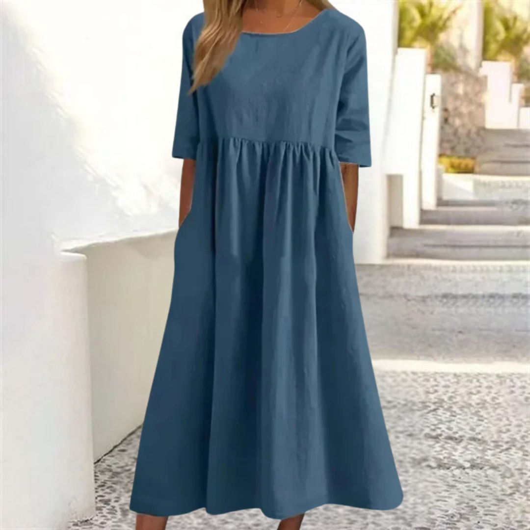 Casual A-line women's summer midi dress, perfect for vacation, with a smocked waist & comfy fabric.