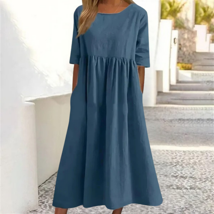 Casual A-line women's summer midi dress, perfect for vacation, with a smocked waist & comfy fabric.