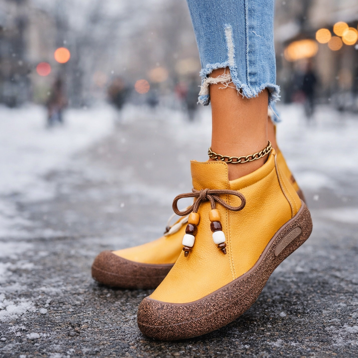 Pair of women's grey leather ankle boots, casual and shock-absorbing, ideal for daily comfortable wear.