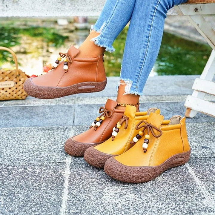 Women's leather casual ankle boots in a classic dark brown, showcasing durability and fall fashion appeal.