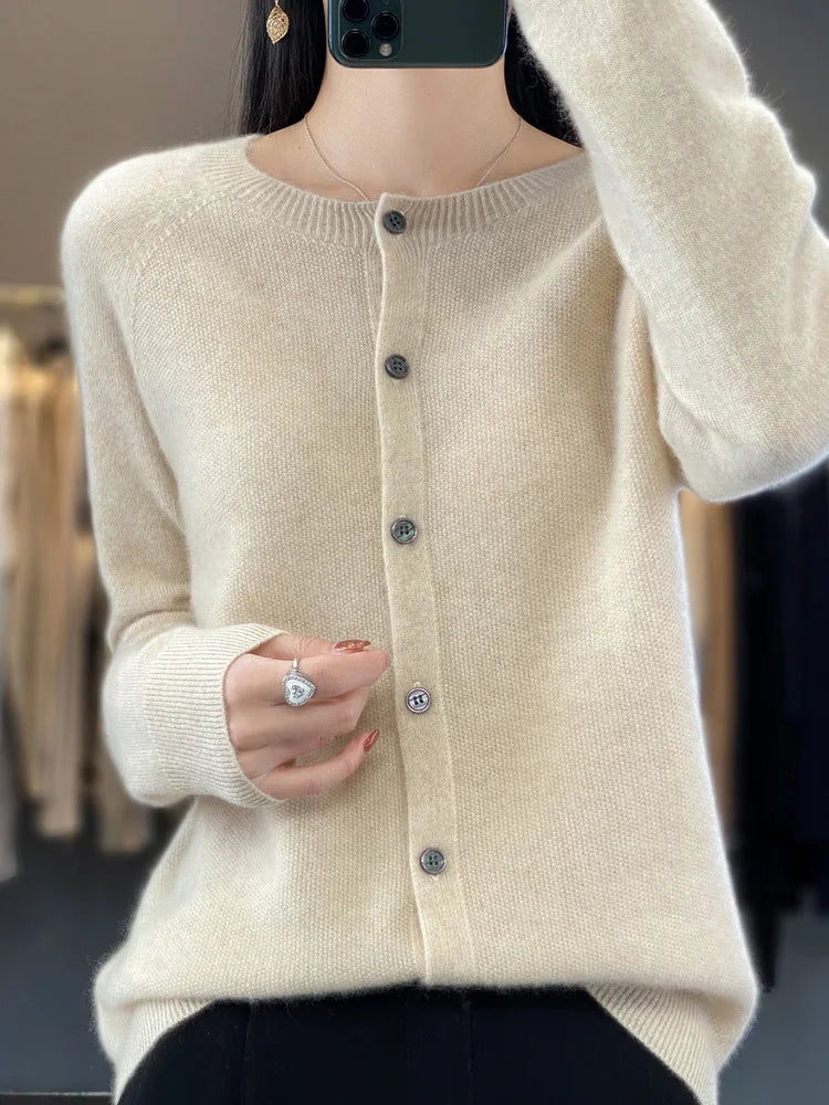 Cozy round neck, long sleeve knit cardigan. Soft button front sweater, perfect layering piece.