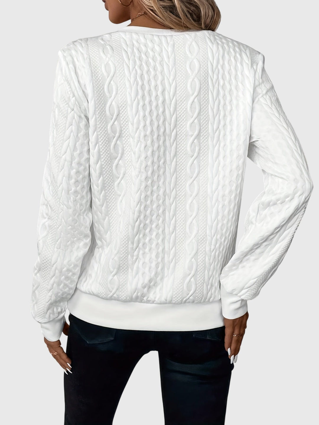 Textured women's cable knit quarter-zip sweater, a warm pullover for winter and casual wear.
