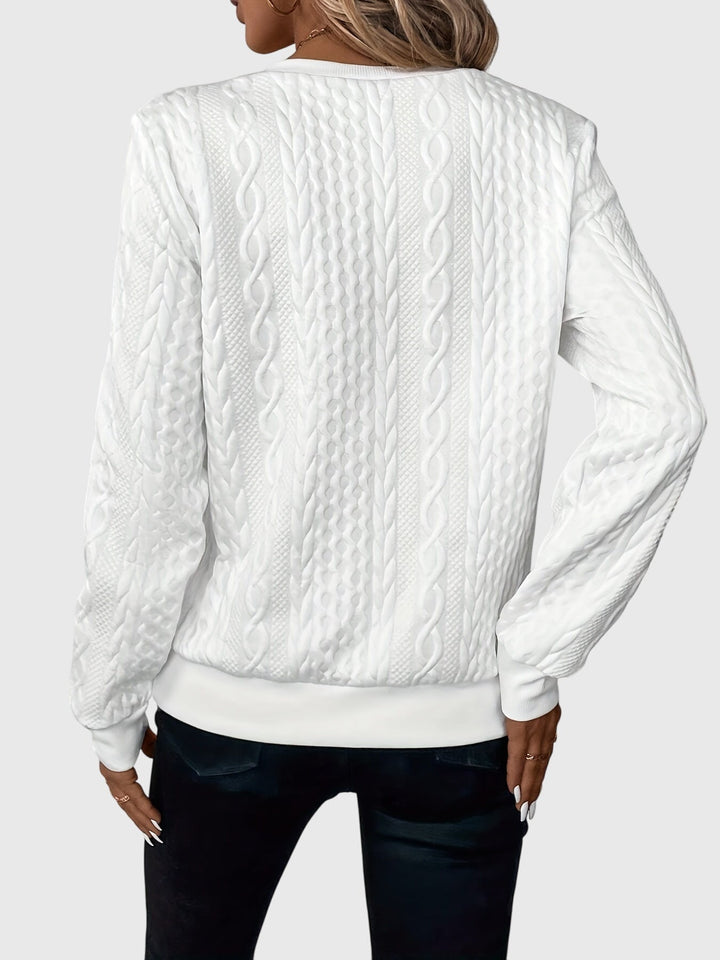 Textured women's cable knit quarter-zip sweater, a warm pullover for winter and casual wear.