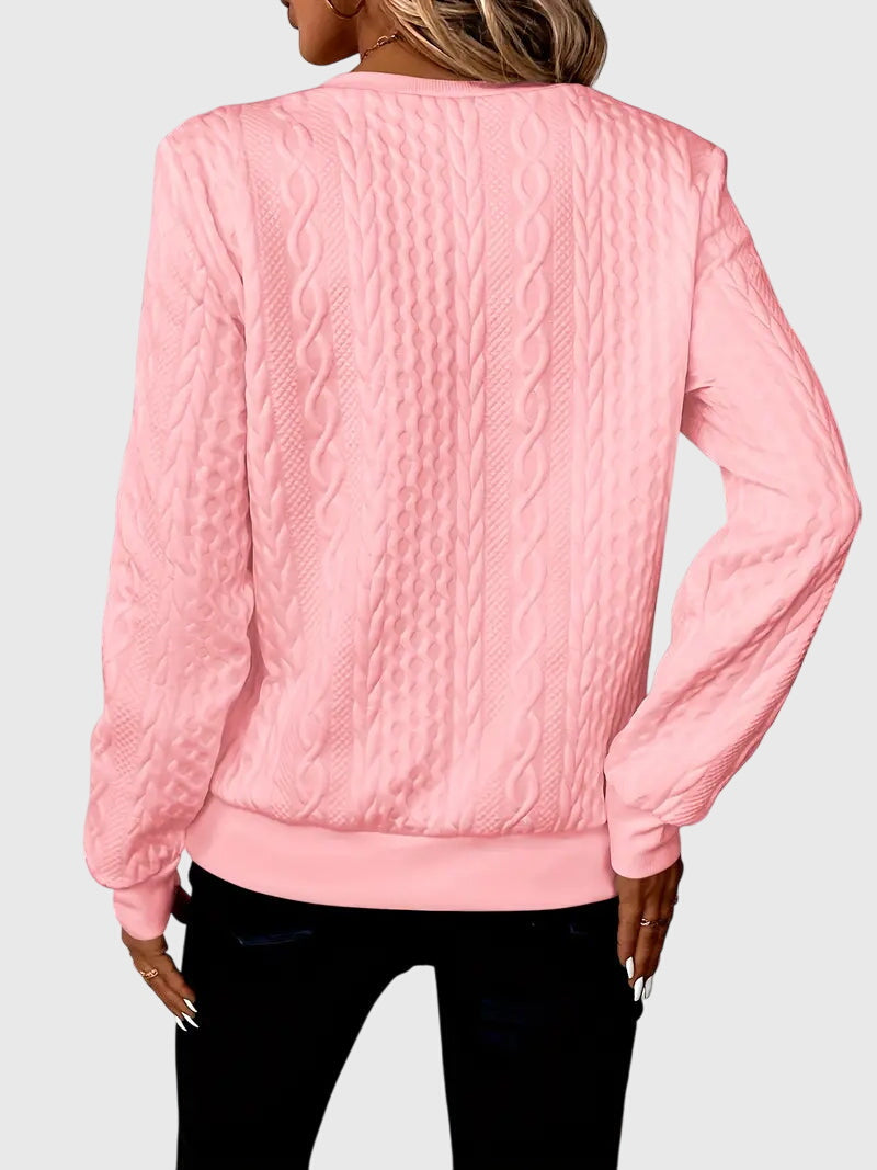 Women's cable knit quarter-zip sweater, an ideal textured top for fall and winter fashion.