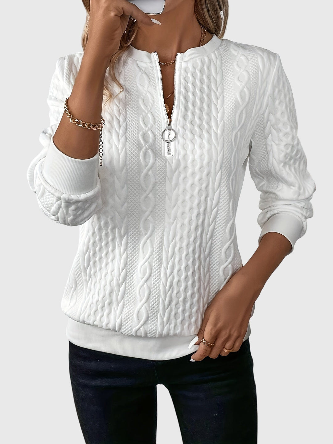 Versatile women's cable knit quarter-zip top, perfect for everyday style and layering.