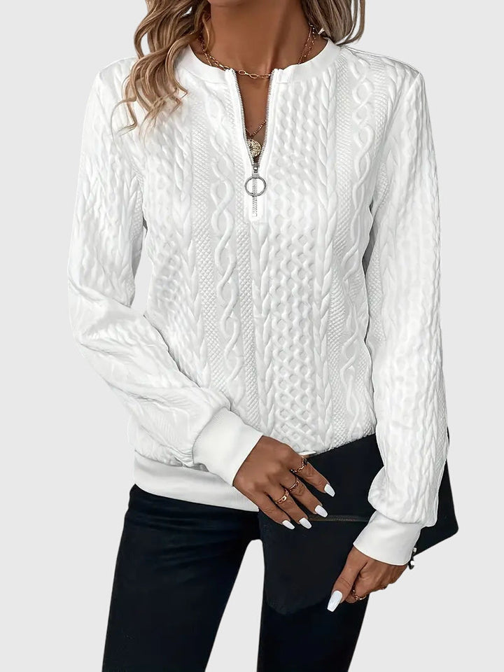 Chic women's cable knit quarter-zip pullover sweater, a modern fit for fall warmth.