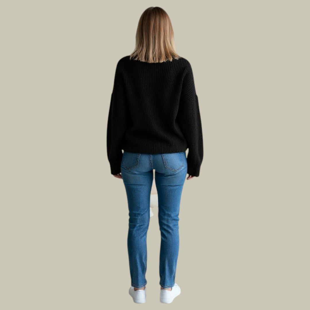 Close-up of the knit texture on a women's casual relaxed fit high neck winter sweater