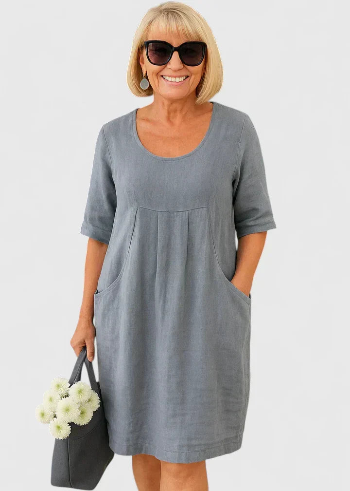 Lightweight women's casual A-line summer midi dress with half sleeves, scoop neck, and essential side pockets.