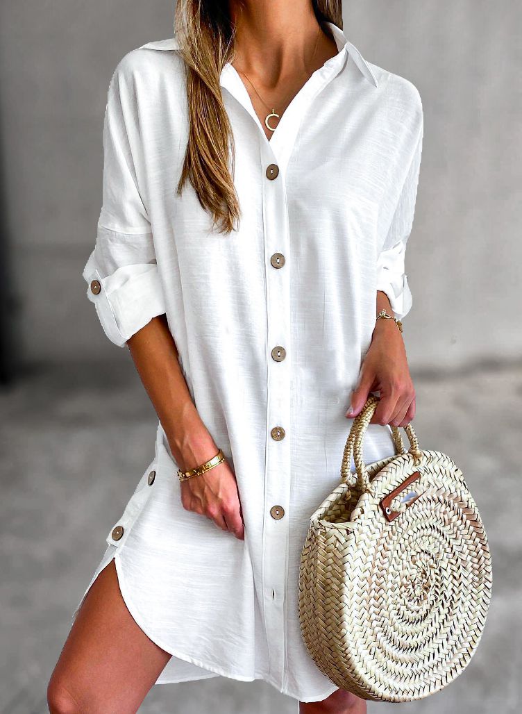 Lightweight women's button-down shirt dress with roll-tab sleeves, ideal for casual summer fashion.