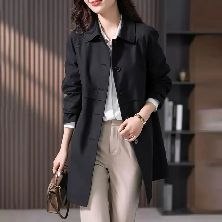 Lightweight women's spring trench coat in a casual style with prominent button-front details