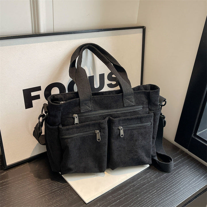 Collection of women's corduroy tote and shoulder bags in different color options, highlighting variety.