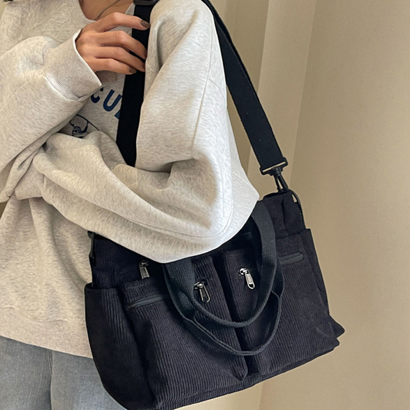 Women's fashion corduroy shoulder bag, styled with a sophisticated yet relaxed aesthetic.